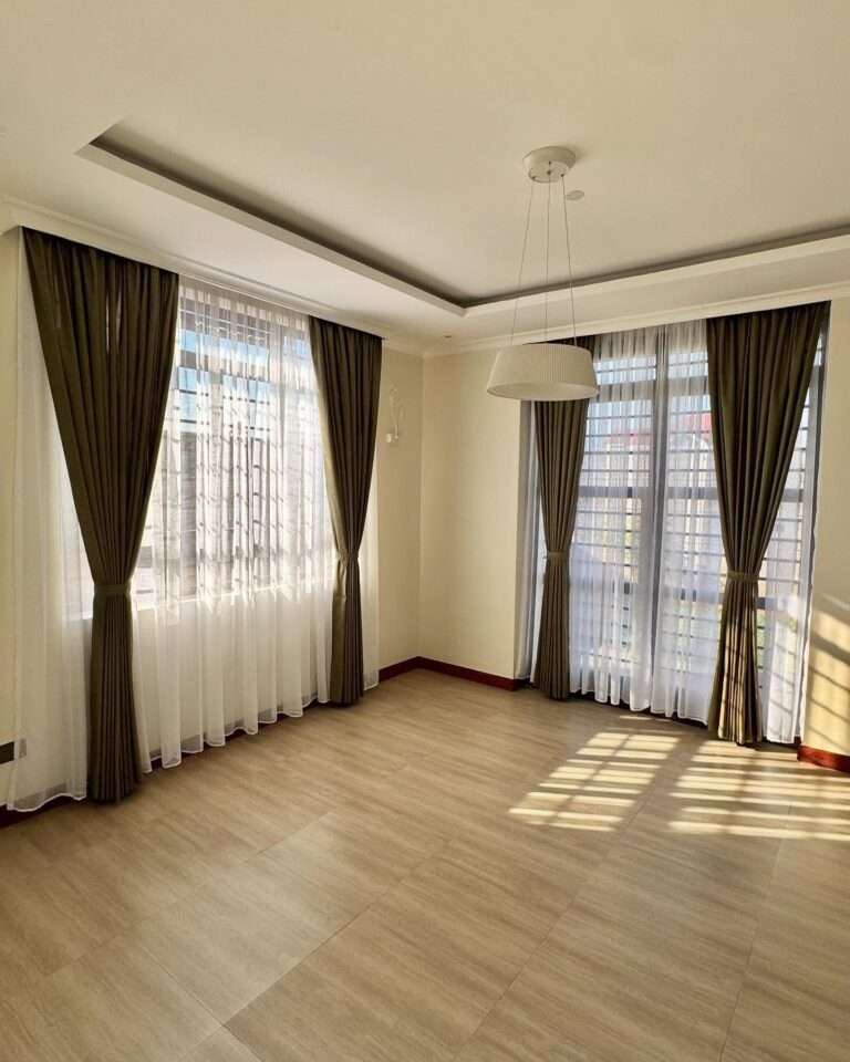 Stylish living room featuring premium curtains and sheers installed by Kalus Top Curtains