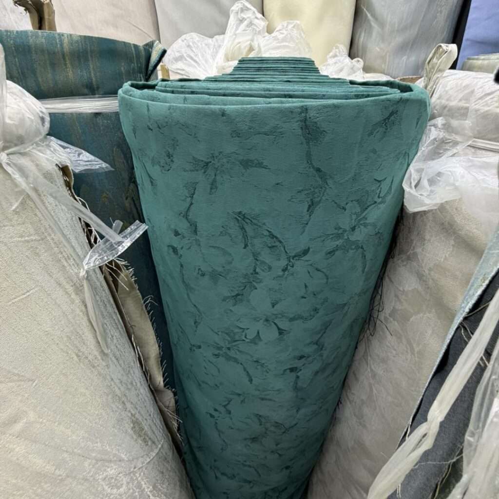 Different curtain fabric materials including sheer, linen, and blackout fabrics displayed