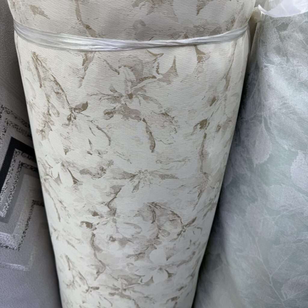 Different curtain fabric materials including sheer, linen, and blackout fabrics displayed