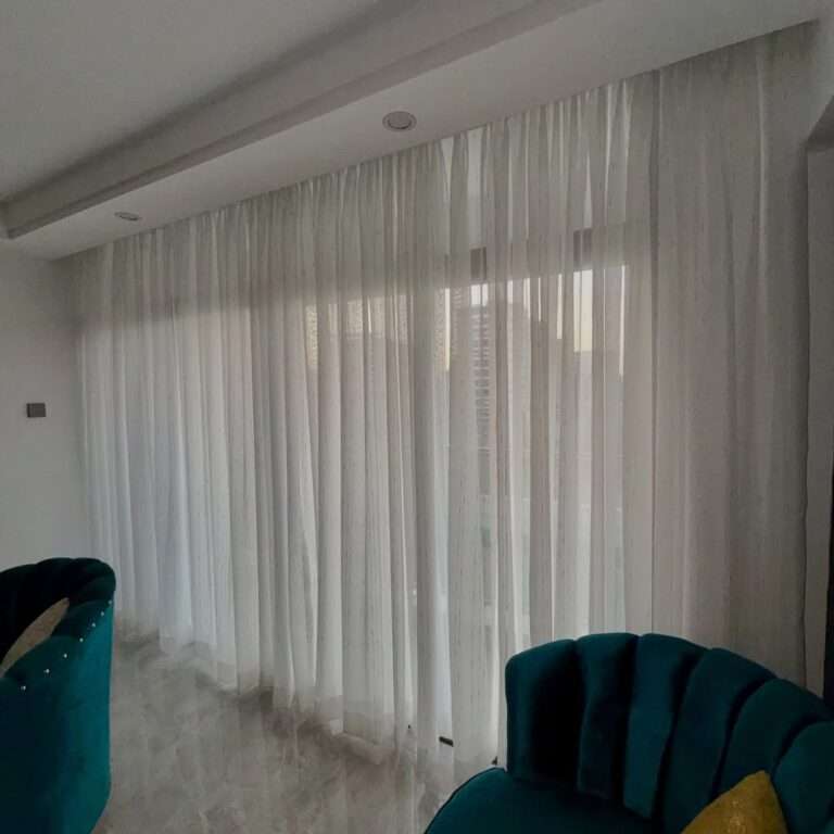 Premium sheer curtains Kenya professionally installed by Kalus Top Curtains in a modern living room with natural daylight