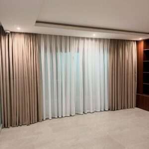 Professional curtain track installation by Kalus Top Curtains in a modern Kenyan living room with ceiling-mounted curtain rails